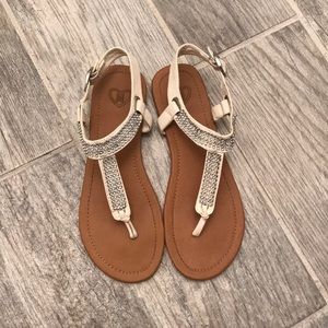 White sandals with jewels.